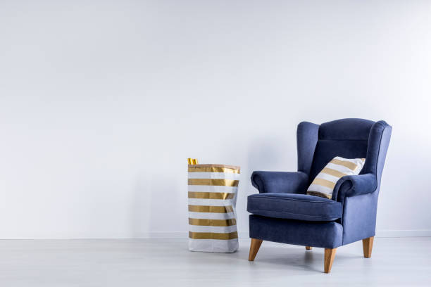 istock Gold pillow on garnet armchair 846752340