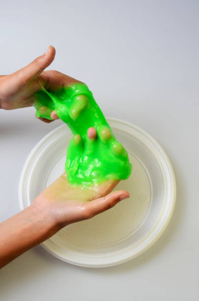 istock Pate slime elastic and viscous on child's hand 846755634