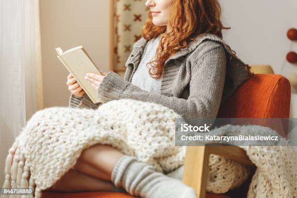 Woman Reading A Book Stock Photo - Download Image Now - Reading, Book, Cozy