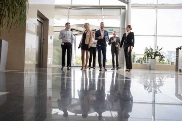 istock Business people entering lobby 846763500