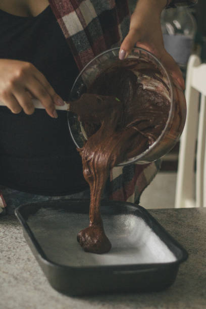 istock Putting a brownie mixing on a baking sheet 846770484