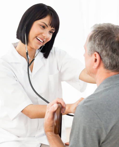 istock Senior laughing with his nurse 846770642