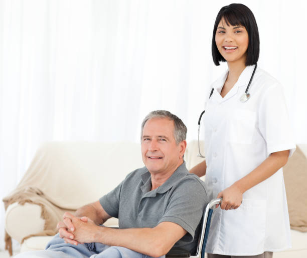 istock Nurse with her patient looking at the camera 846771026