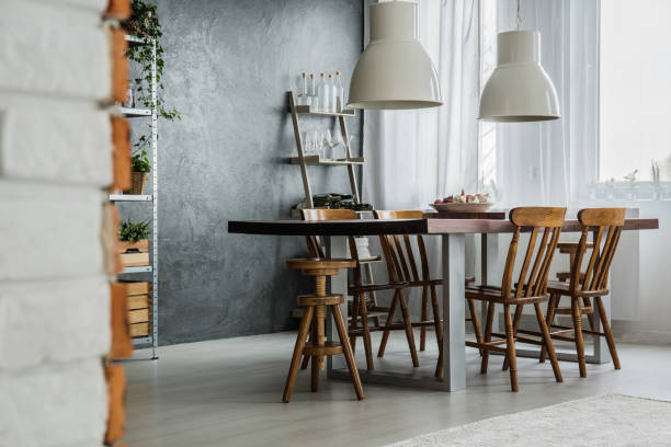 istock Communal table and industrial lamps 846771188