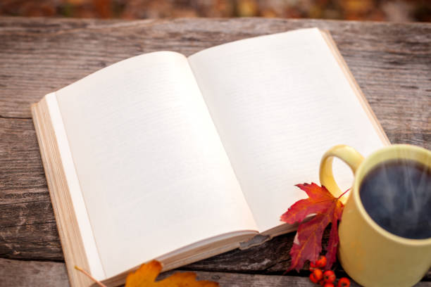 istock Book with open pages and mug with hot tea 846775058