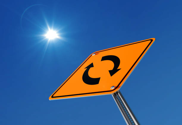 Yellow change ahead traffic sign on blue sky. Change concept. Low Angle view. Vertical composition with copy space. Clipping path is included.