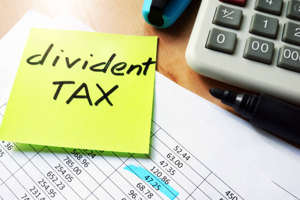 istock Stick with words dividend tax on a table. 846781914