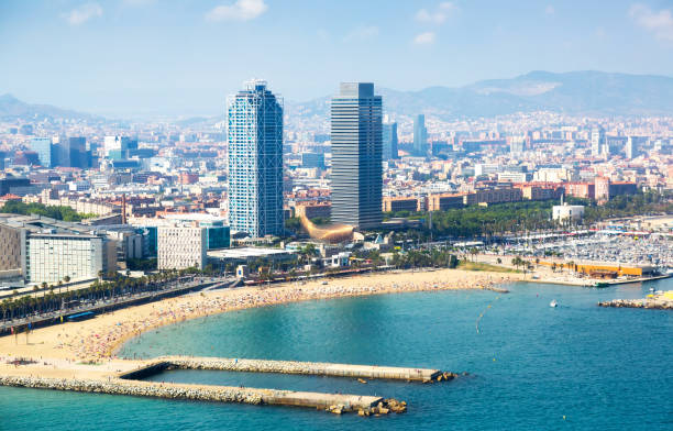 istock beach with many people resting at Barcelona seaside 846785662