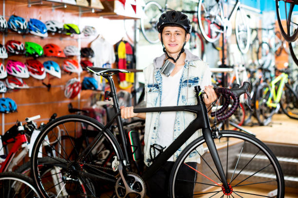 istock Boy looking for and trying new racing bicycle 846785918