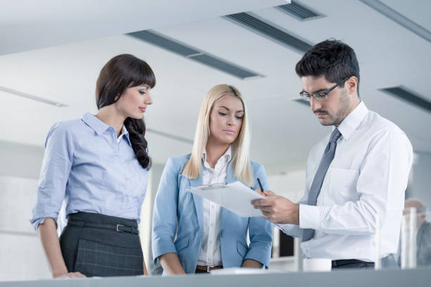 istock Business People having meeting and reviewing documents at the office 846789548