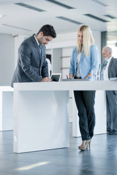 istock Young coworkers working together in office 846789634