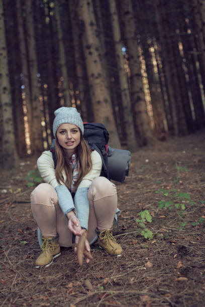 istock Woman crouching in the woods. 846790192