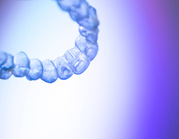 istock Invisible teeth retainers orthodontic brackets. Plastic modern straighterners to correct tooth alignment. 846798362