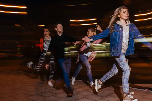 istock Young people party in city. Blurred background 846800642