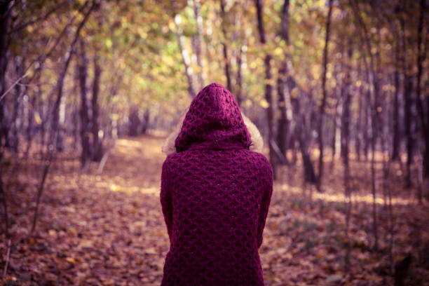 istock Woman in autumn park 846800950
