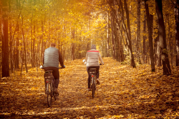 istock Couple Cycling in autumn park 846805742