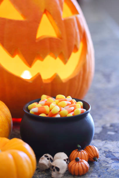 istock Pot Of Candy Corn And Jack O Lantern 846814706
