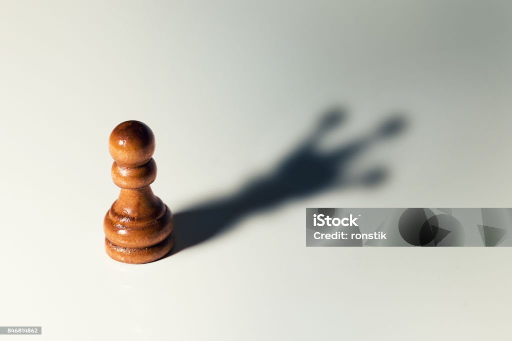 trust yourself concept - chess pawn with king shadow Confidence Stock Photo