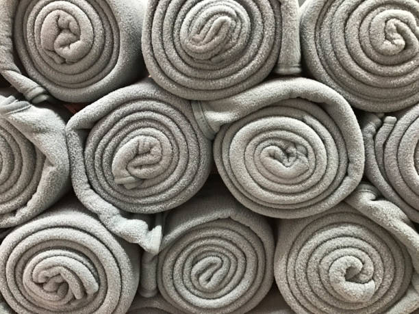 Pile of folded gray blankets