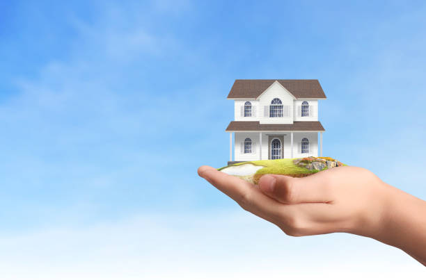 istock Mortgage concept by house from  hand 846816108