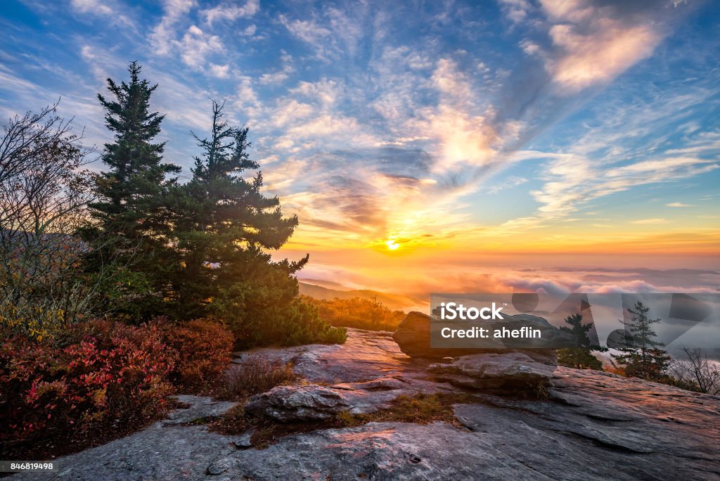 Scenic sunrise over fog filled valley An amazing sunrise over the Blue Ridge Mountains of North Carolina during autumn. North Carolina - US State Stock Photo
