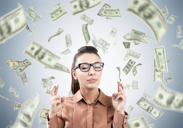 istock Woman with crossed fingers, dollar rian 846837042
