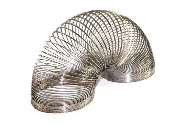 istock Vintage Rusty Metal Slinky toy on White Background 846837064