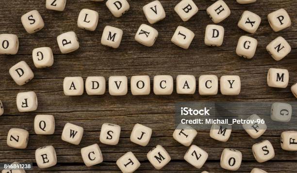 Word Advocacy Written On Wood Block Stock Photo - Download Image Now - Assistance, Individuality, Alphabet