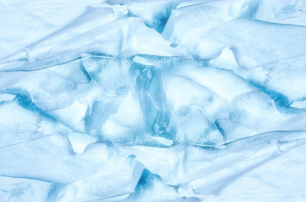 Close-up of snow texture on a ski slope with skis imprints.