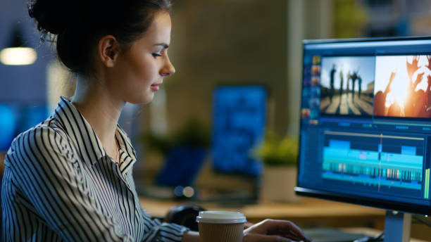 istock Beautiful Female Videographer Edits Footage on Her Personal Computer, She Works in Creative Office Space Late at Night. 846842998