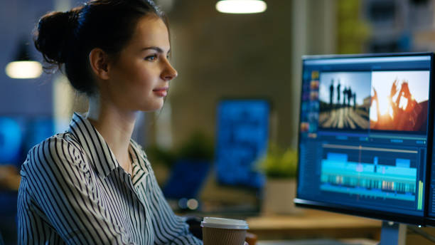 istock Beautiful Female Videographer Edits Footage on Her Personal Computer, She Works in Creative Office Space Late at Night. 846843004