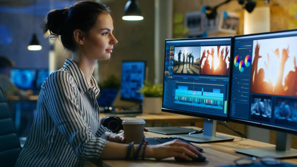 istock Beautiful Female Video Editor Works with Footage on Her Personal Computer, She Works in Creative Office Studio. 846843006
