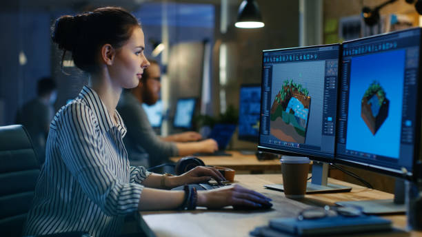 istock Female Game Developer Works on a Level Design on Her Personal Computer with Two Displays. She works in a Creative Office Space. 846843066