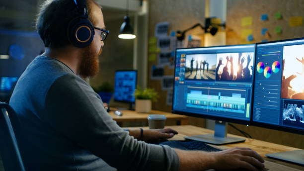 10 Ways to Optimize Your Computer for Music Production 9 male videographer edits and cuts footage and sound on his personal computer puts on his