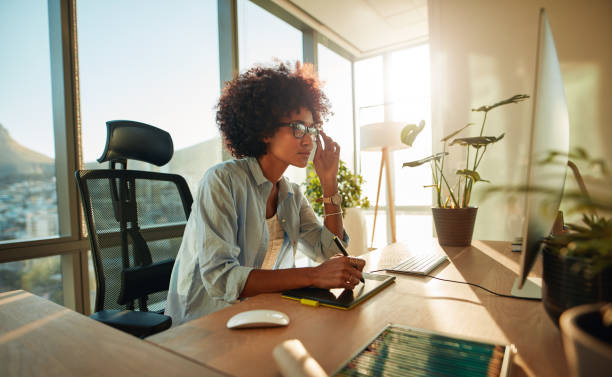 istock African female designer busy working at her desk 846846972