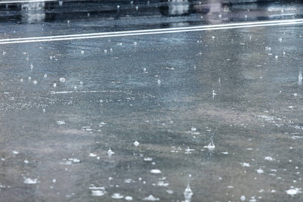 istock raindrops on asphalt road during rainy weather 846851832