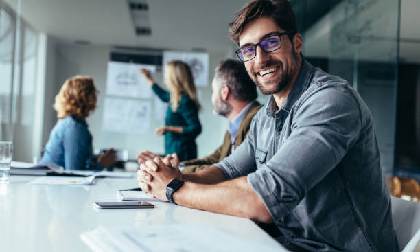 istock Smiling designer sitting in conference room 846855728
