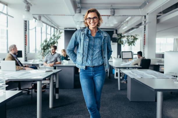 istock Cheerful businesswoman standing in office environment 846855942