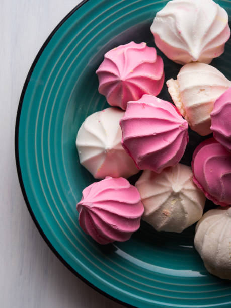 istock Pastel color meringue on green 846856208