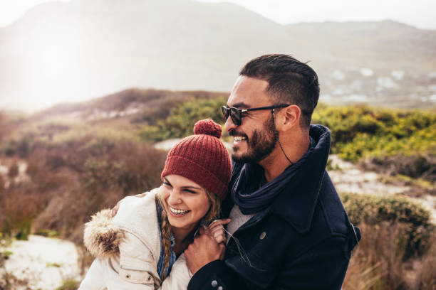 istock Couple enjoying a winter day at the beach 846856448