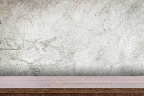 istock wood table and cement wall for display and montage for product. 846859366