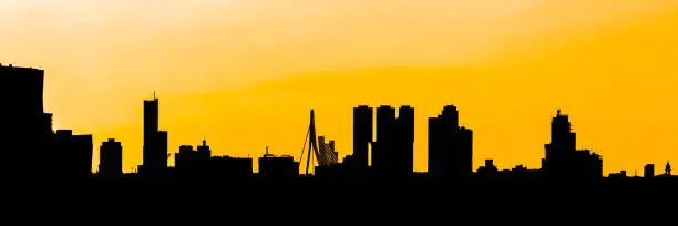 contours of the skyline of Rotterdam against a yellow background