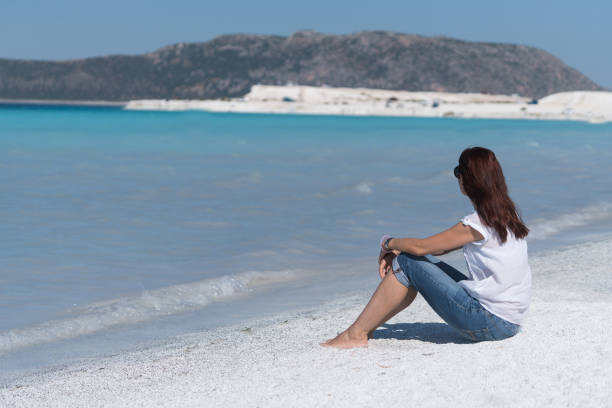 istock Beautiful young woman enjoying the beach 846859486