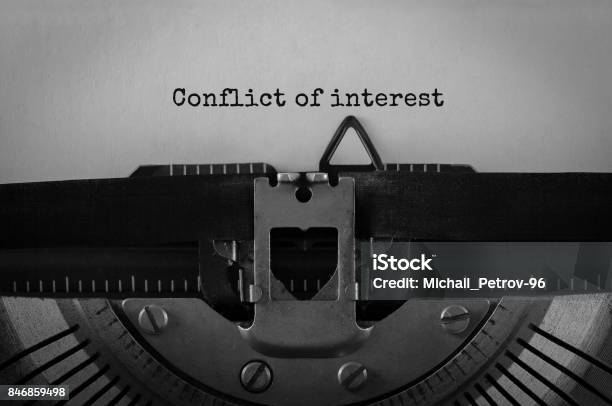 Text Conflict Of Interest Typed On Retro Typewriter Stock Photo - Download Image Now