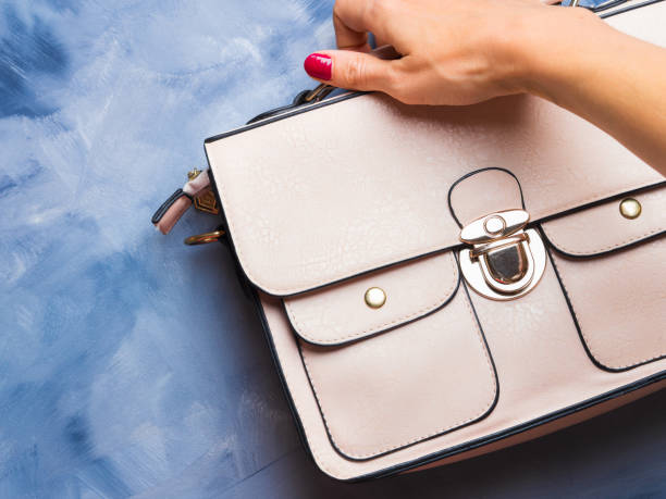 istock Pink lady's bag on blue background 846860244