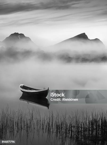 Very Peaceful Summer Night With Wooden Boat And Fog In Lofoten Norway Stock Photo - Download Image Now