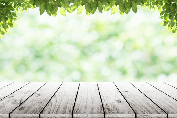 istock Empty wooden table with party in garden background blurred. 846872094