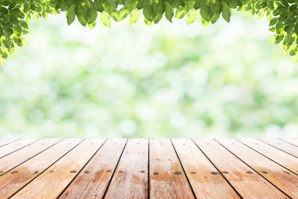 istock Empty wooden table with party in garden background blurred. 846872154