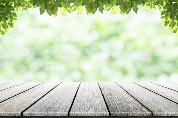 istock Empty wooden table with party in garden background blurred. 846874216