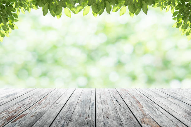 istock Empty wooden table with party in garden background blurred. 846874396